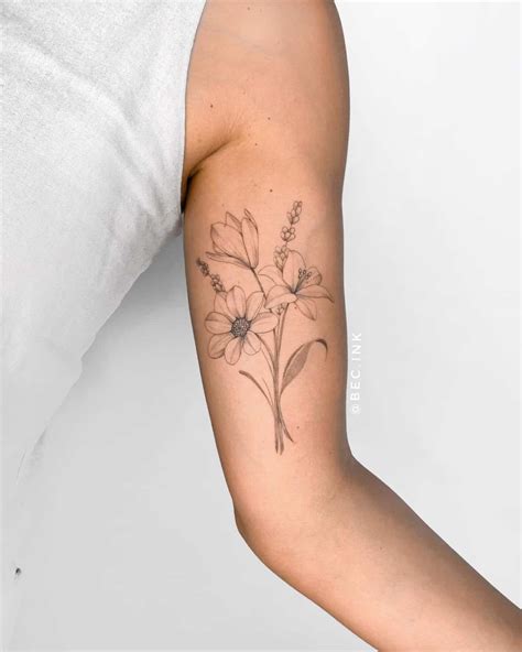 upper arm flower tattoo|More.